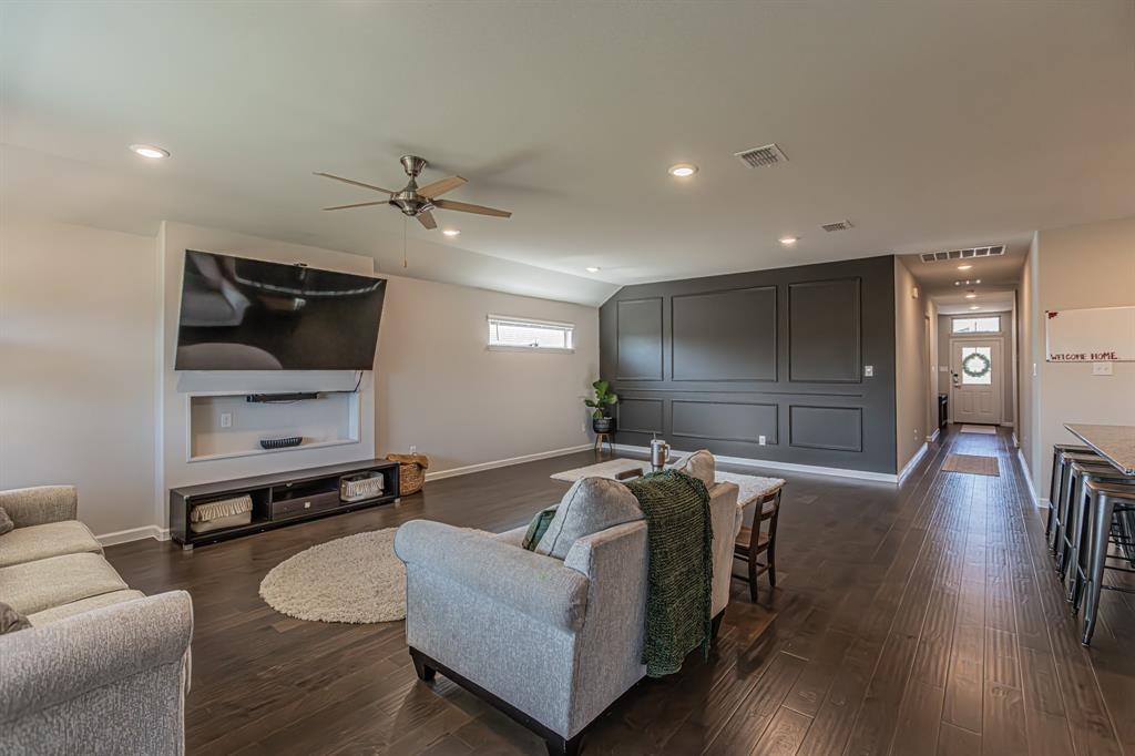 10269 Hanks Creek Road Fort Worth, TX 76126 - Photo 21 of 40 a living room with furniture and a flat screen tv