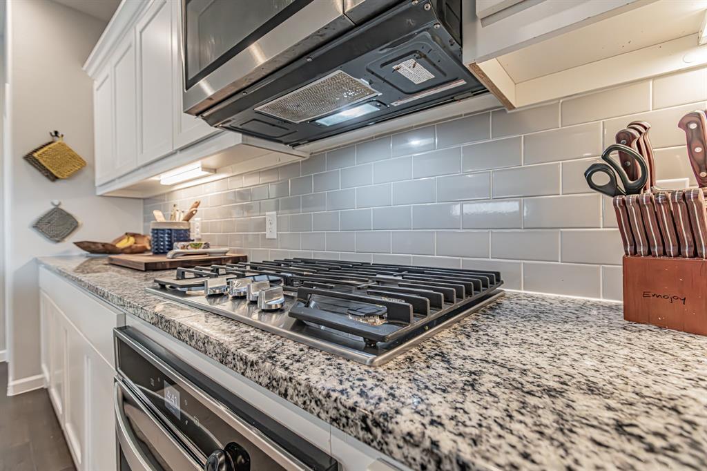 10269 Hanks Creek Road Fort Worth, TX 76126 - Photo 29 of 40 a stove top oven sitting inside of a kitchen