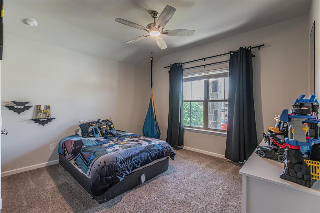 10269 Hanks Creek Road Fort Worth, TX 76126 - Photo 4 of 40 a bedroom with a bed and a window