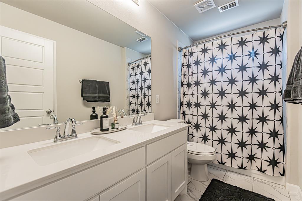 10269 Hanks Creek Road Fort Worth, TX 76126 - Photo 6 of 40 a bathroom with a sink toilet and shower