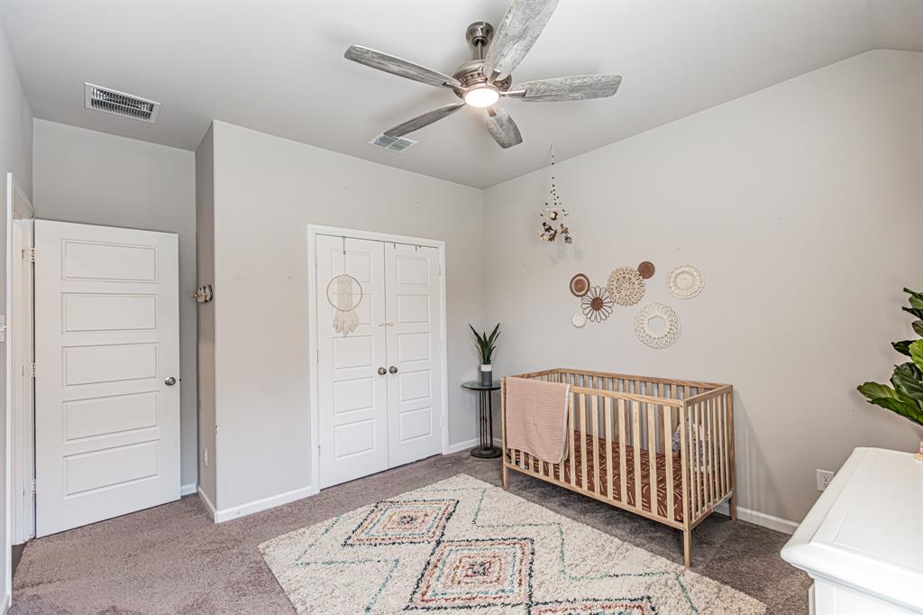 10269 Hanks Creek Road Fort Worth, TX 76126 - Photo 8 of 40 wooden floor with chandelier fan and windows
