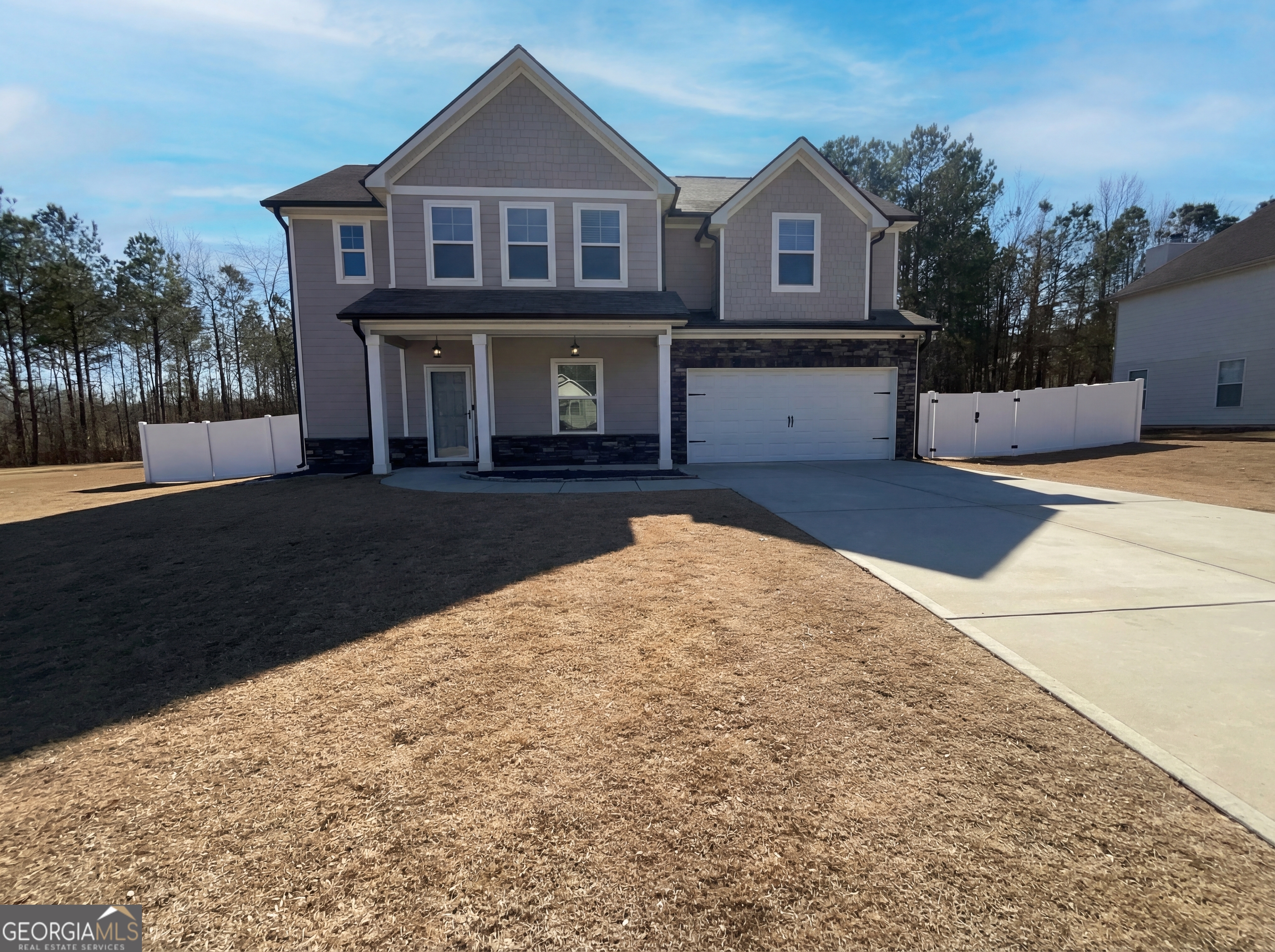 981 Fellowship Road, Unit 108 Fairburn, GA 30213 - Photo 1 of 21 a front view of a house with a yard