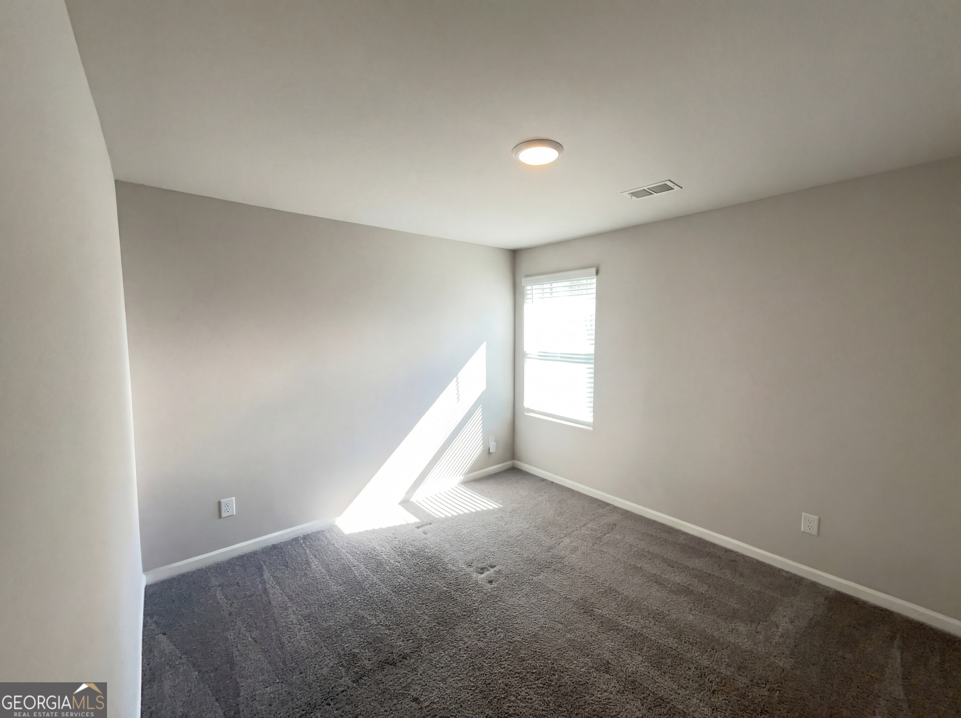 981 Fellowship Road, Unit 108 Fairburn, GA 30213 - Photo 13 of 21 an empty room with a window
