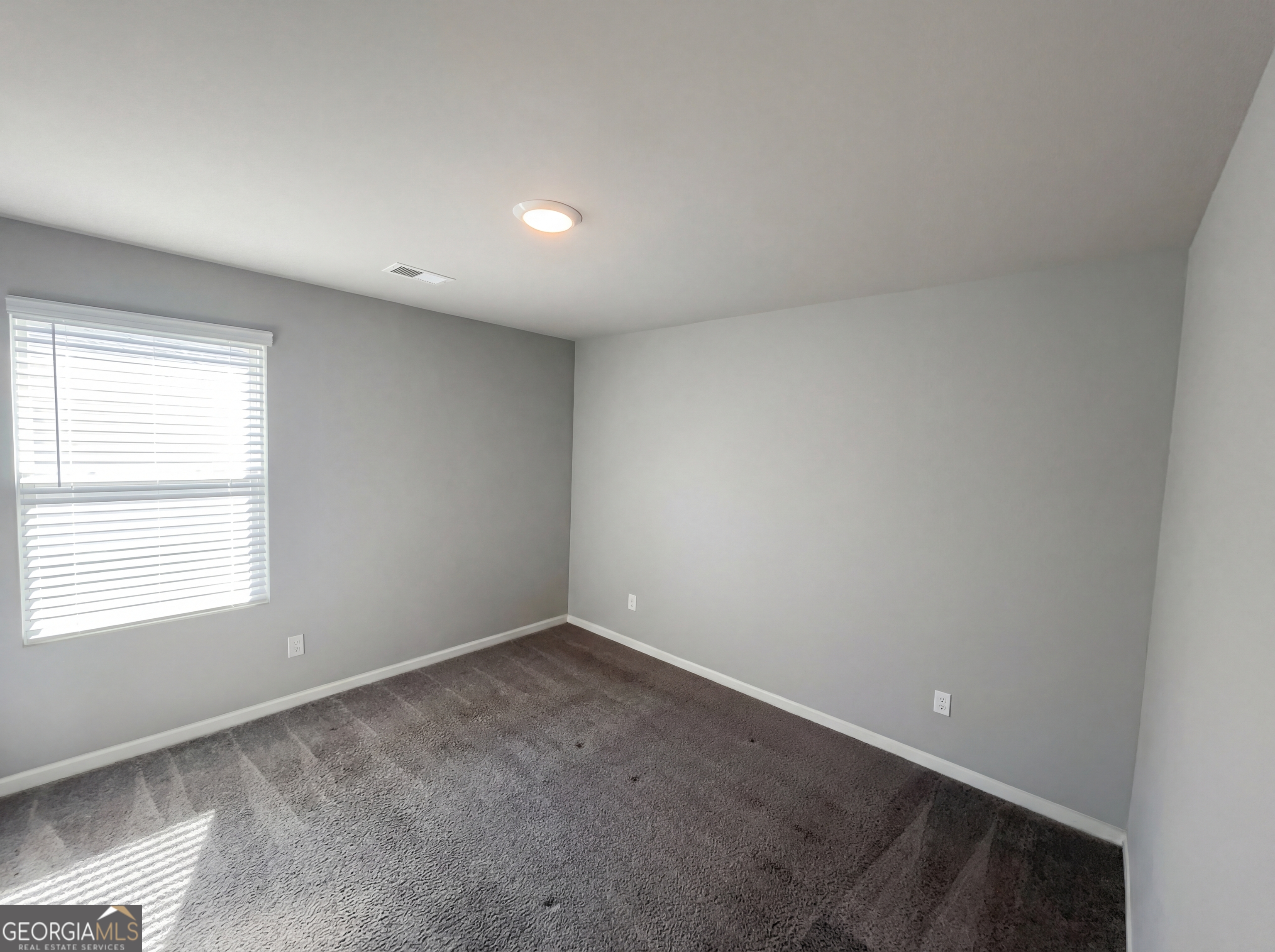 981 Fellowship Road, Unit 108 Fairburn, GA 30213 - Photo 16 of 21 an empty room with a window