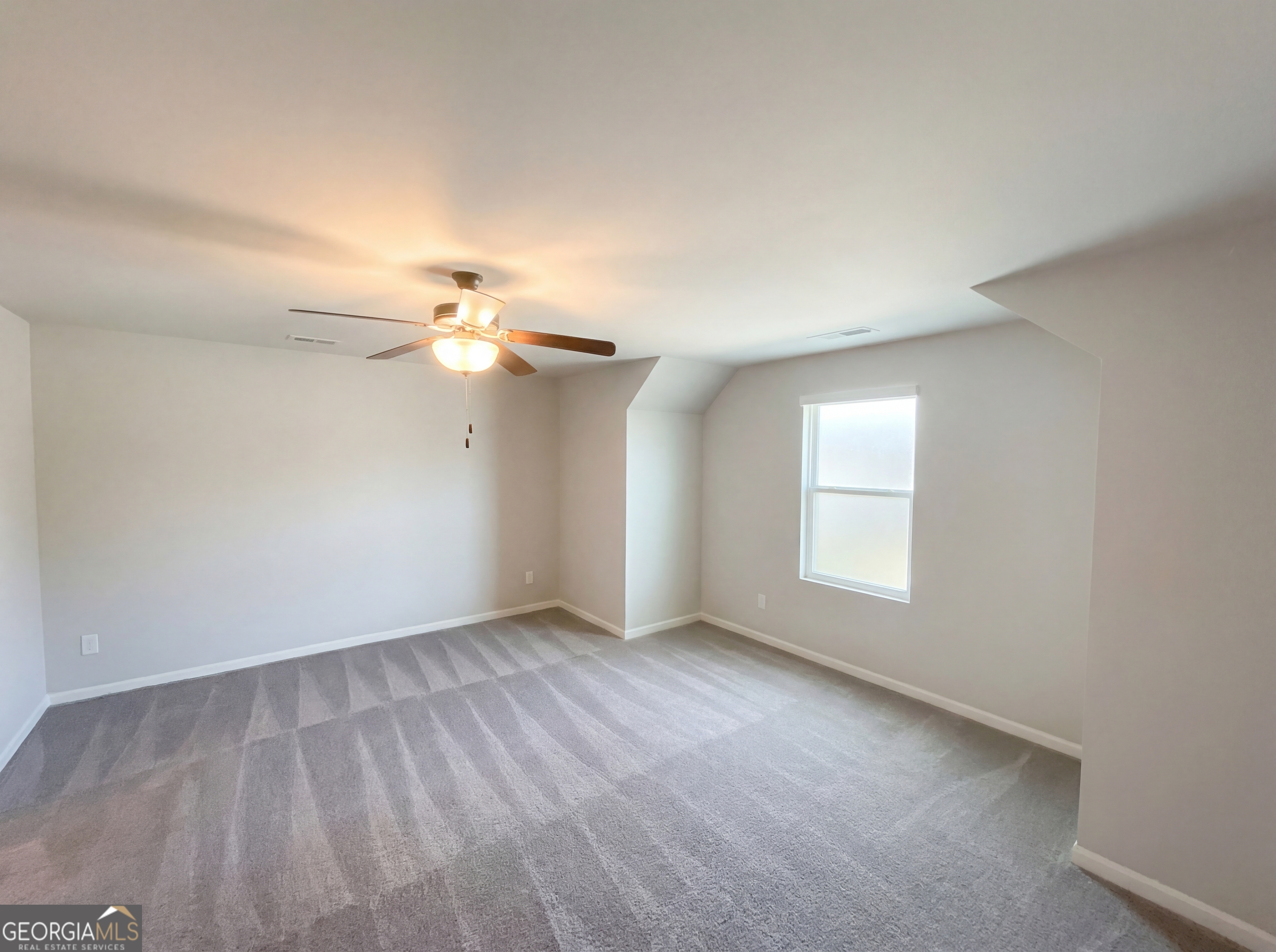 981 Fellowship Road, Unit 108 Fairburn, GA 30213 - Photo 18 of 21 wooden floor in an empty room with a window