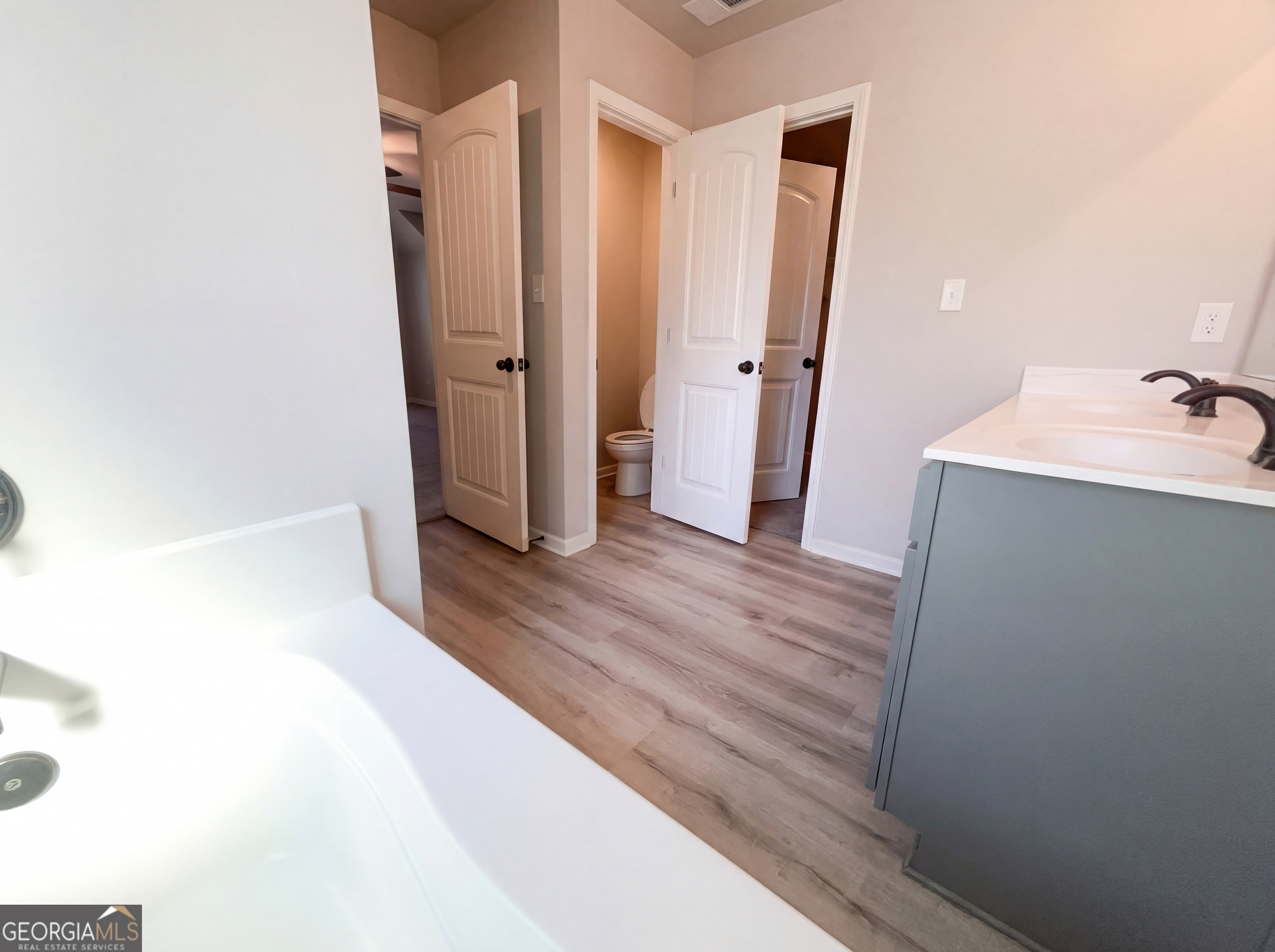 981 Fellowship Road, Unit 108 Fairburn, GA 30213 - Photo 20 of 21 a view of a bathroom from a hallway
