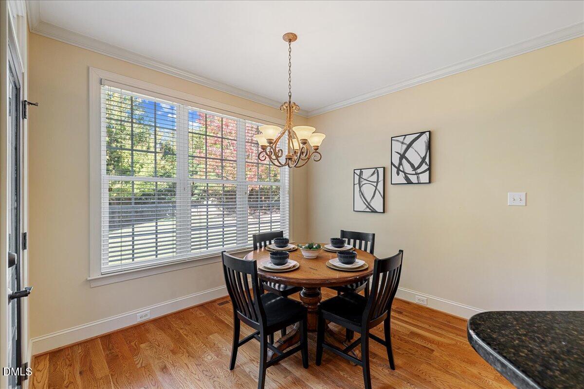 3628 Jamison Park Drive Apex, NC 27539 - Photo 12 of 60 a dining room with furniture and window