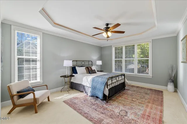 a bedroom with a bed a couch and a window