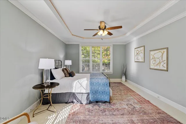 a living room with a bed furniture and a window