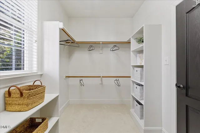 a view of walk in closet with window