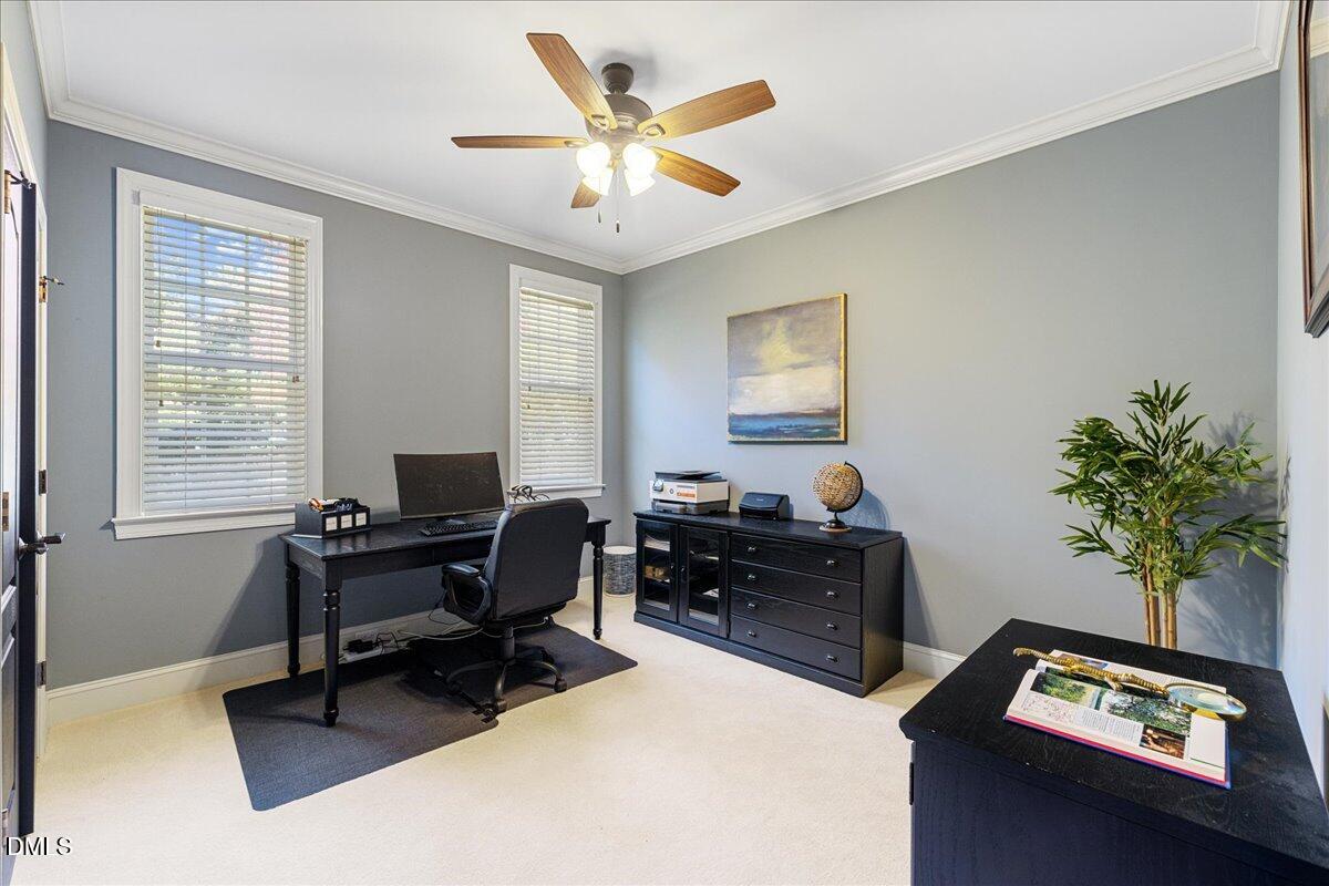 3628 Jamison Park Drive Apex, NC 27539 - Photo 30 of 60 a view of a workspace with furniture and a window