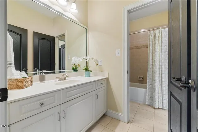 a bathroom with a double vanity sink and a mirror