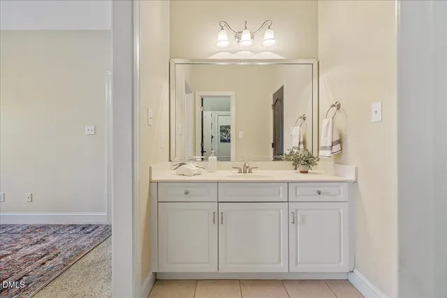 a bedroom with a bed and a ceiling fan