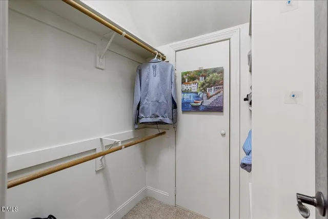 a living room with furniture a flat screen tv and a window
