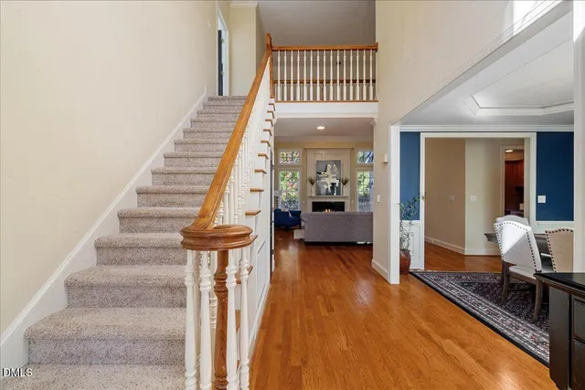 a view of entryway and hall with wooden floor