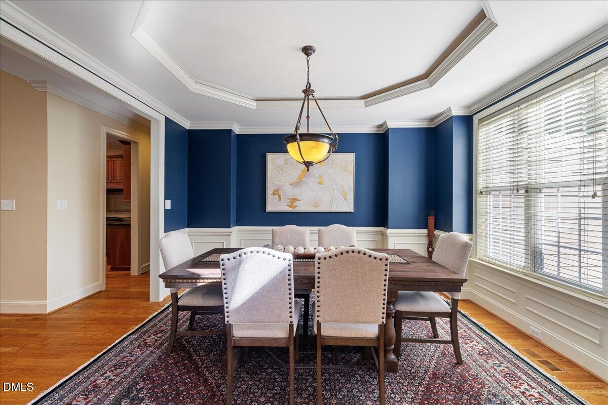 3628 Jamison Park Drive Apex, NC 27539 - Photo 7 of 60 a view of a dining room with furniture window and wooden floor
