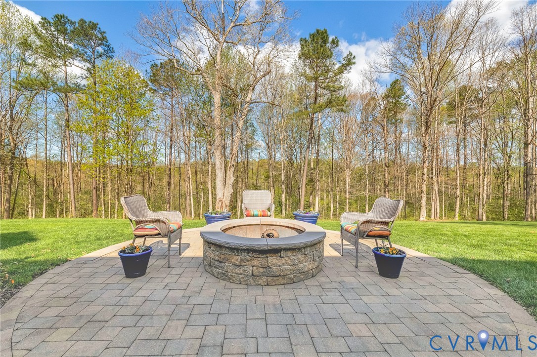 14436 Overlook Ridge Lane Beaverdam, VA 23015 - Photo 61 of 82 a view of a swimming pool with a lounge chair and a garden