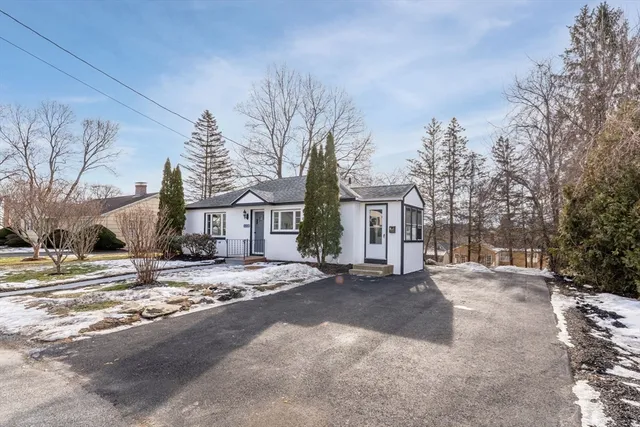 a view of a road with a building in the background