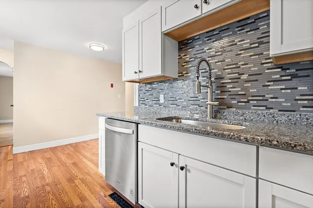 a kitchen with a sink and cabinets