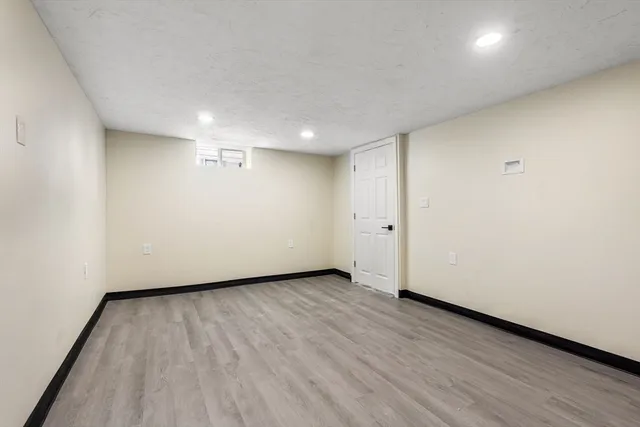 an empty room with wooden floor