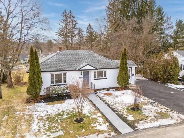 front view of a house with a yard