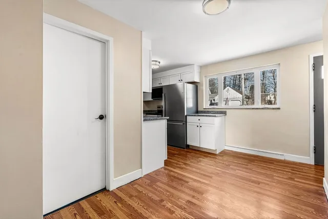 a kitchen with stainless steel appliances a refrigerator and a stove top oven