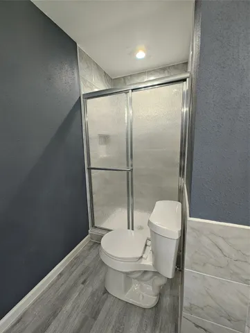 a bathroom with a bathtub and toilet
