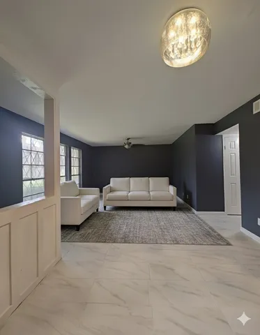 a spacious bedroom with a bed and dresser