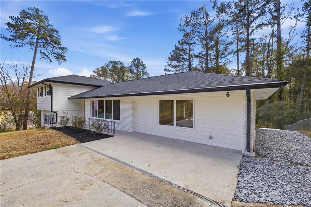 2967 Flat Shoals Road Decatur, GA 30034 - Photo 3 of 37 a view of a house with a patio and a yard