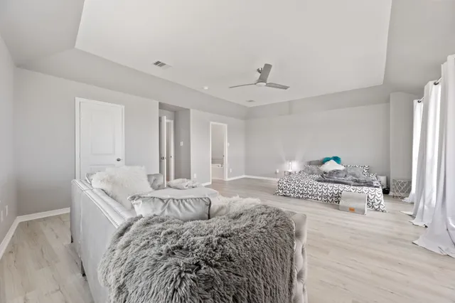 a bed room with a bed and a couch