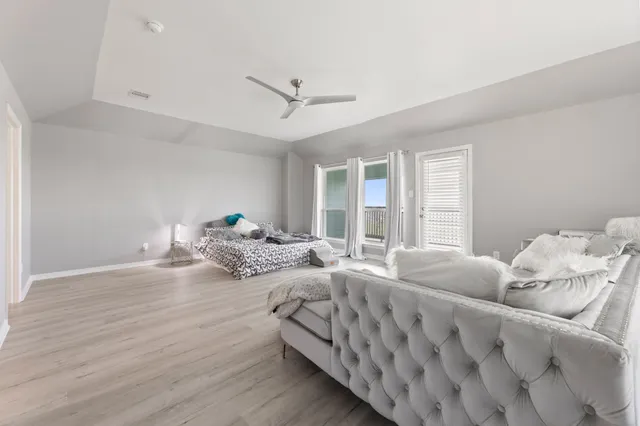 a bedroom with furniture and a window