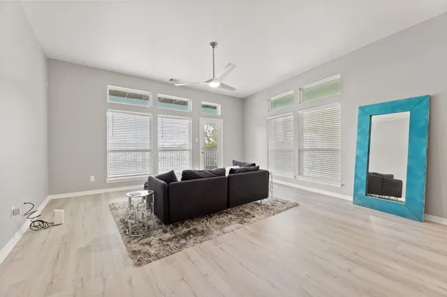 a living room with furniture and windows