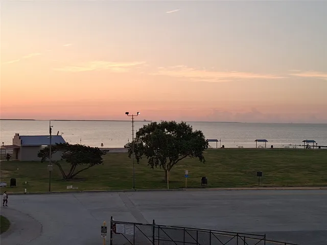 a view of a lake with a yard