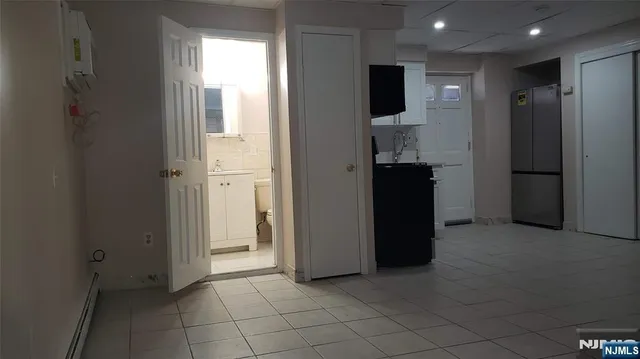 a view of an empty room with a fireplace