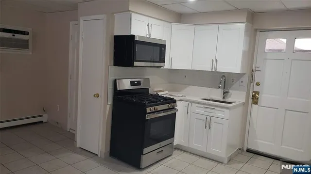 a kitchen with a stove and a microwave