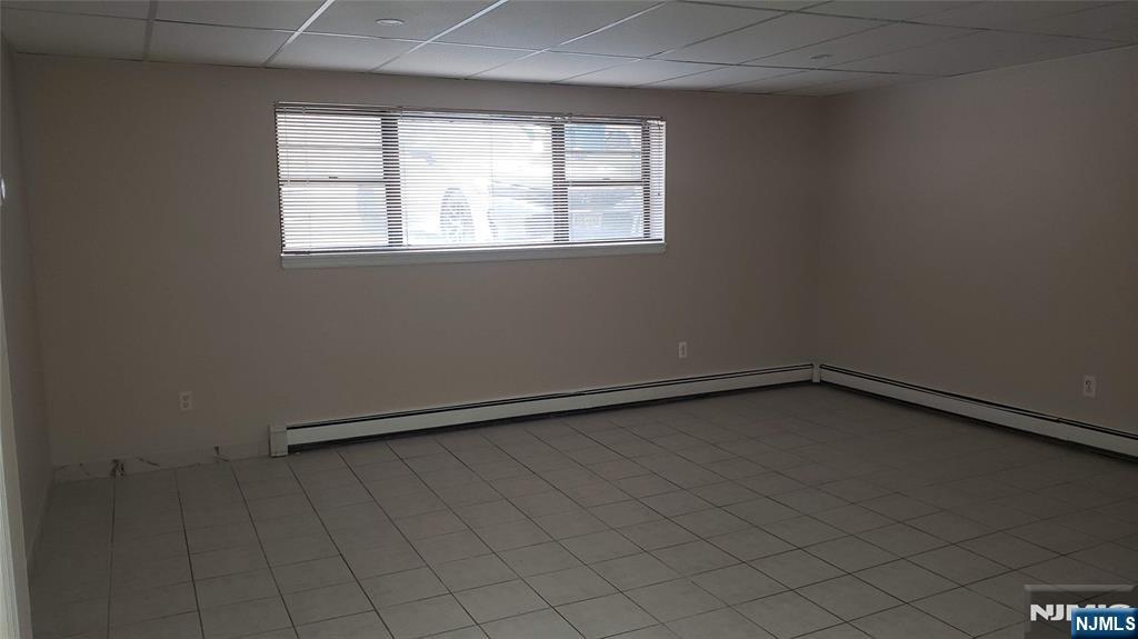 640 Fairview Avenue, Unit 9 Fairview, NJ 07022 - Photo 5 of 14 an empty room with a window