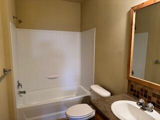 355 Colver Road, Unit 24 Talent, OR 97540 - Photo 13 of 21 a bathroom with a toilet sink and bathtub