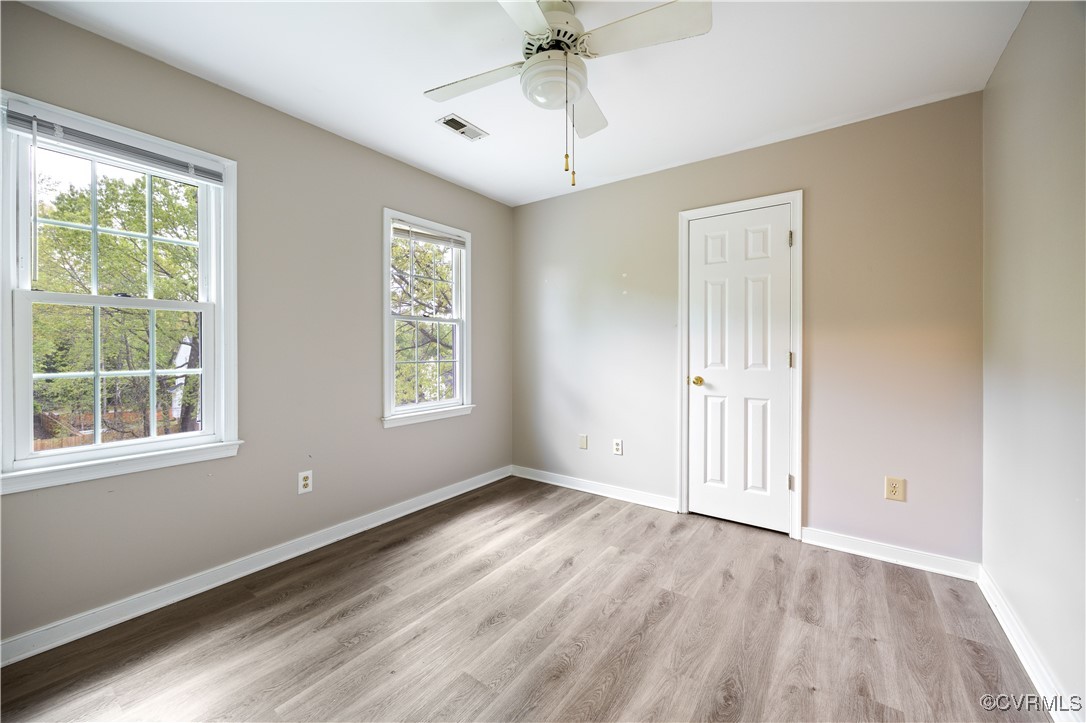 3012 Appleford Drive Chester, VA 23831 - Photo 15 of 25 wooden floor in an empty room with a window