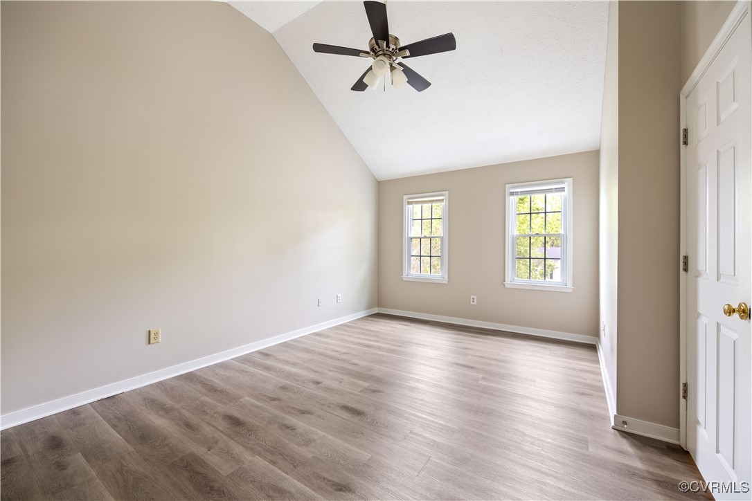 3012 Appleford Drive Chester, VA 23831 - Photo 18 of 25 an empty room with wooden floor ceiling fan and windows