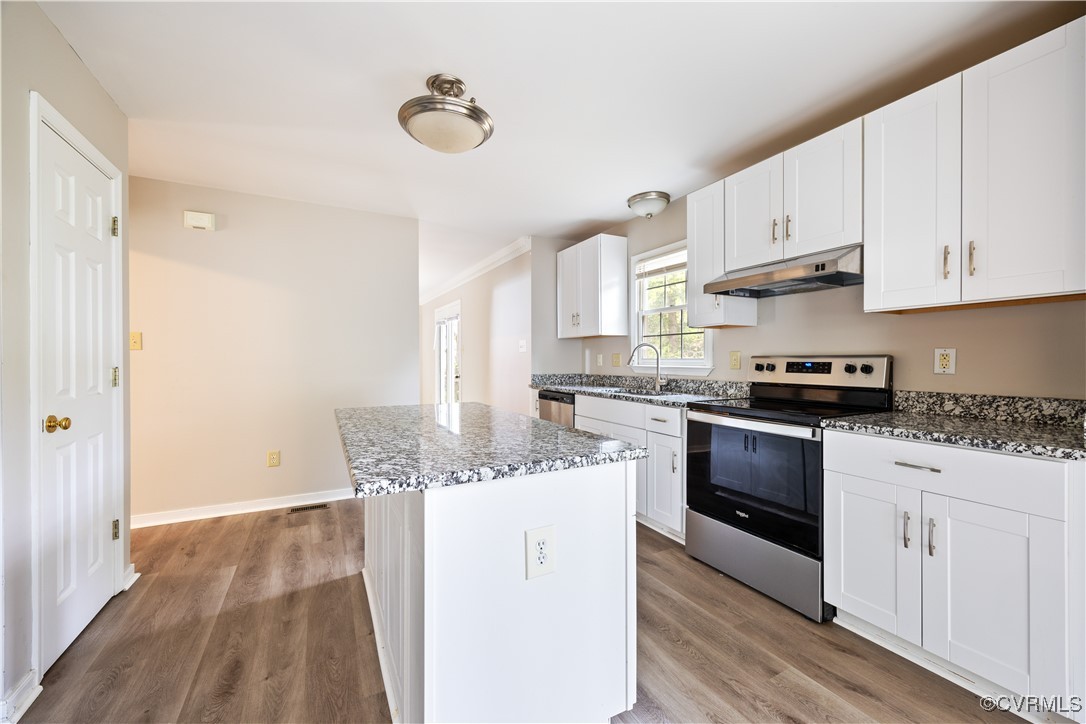 3012 Appleford Drive Chester, VA 23831 - Photo 5 of 25 a kitchen with granite countertop a sink stainless steel appliances and white cabinets