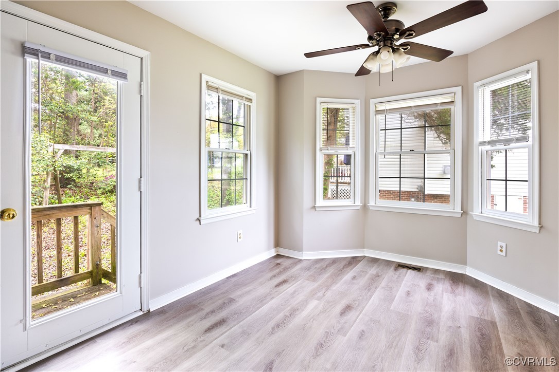 3012 Appleford Drive Chester, VA 23831 - Photo 6 of 25 a view of an empty room with wooden floor and a window