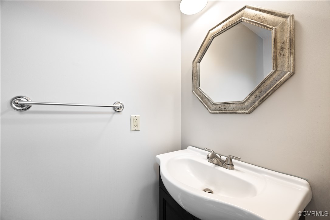 3012 Appleford Drive Chester, VA 23831 - Photo 8 of 25 a bathroom with a sink and mirror