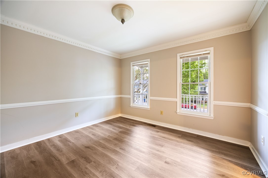 3012 Appleford Drive Chester, VA 23831 - Photo 9 of 25 an empty room with wooden floor and windows