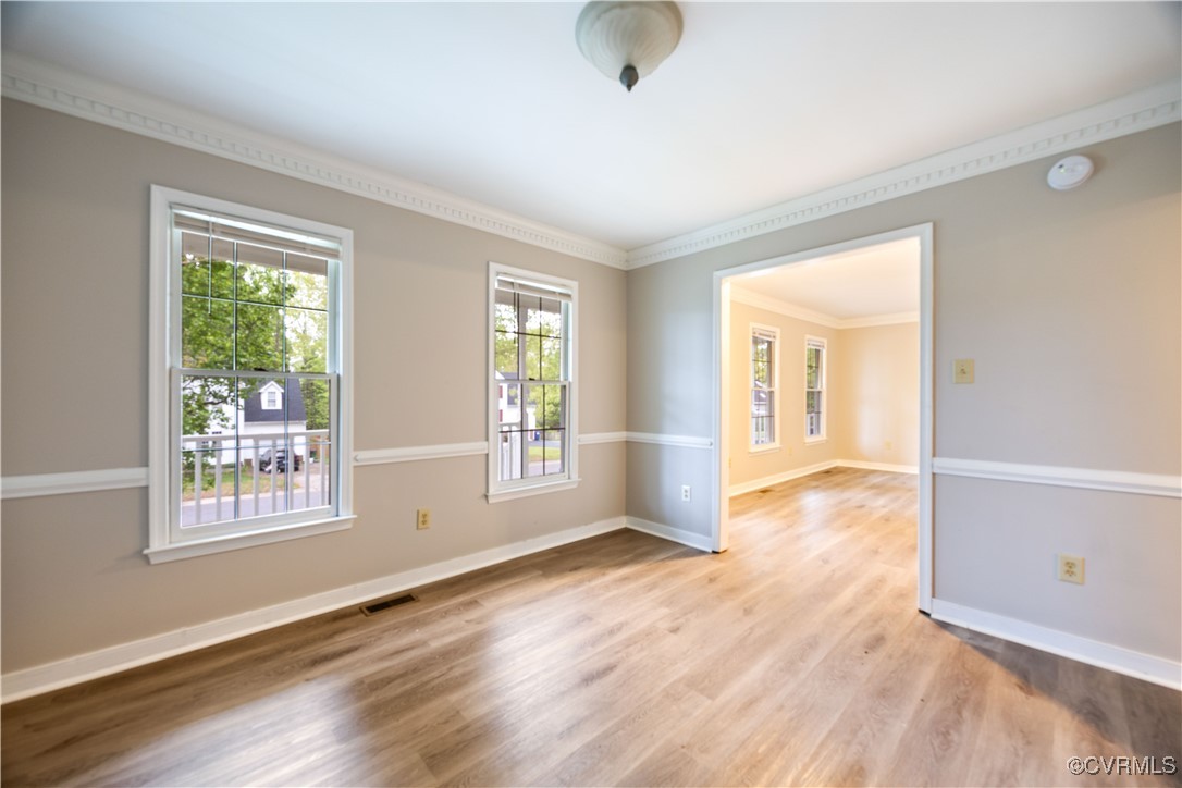 3012 Appleford Drive Chester, VA 23831 - Photo 10 of 25 a view of an empty room with wooden floor and a window