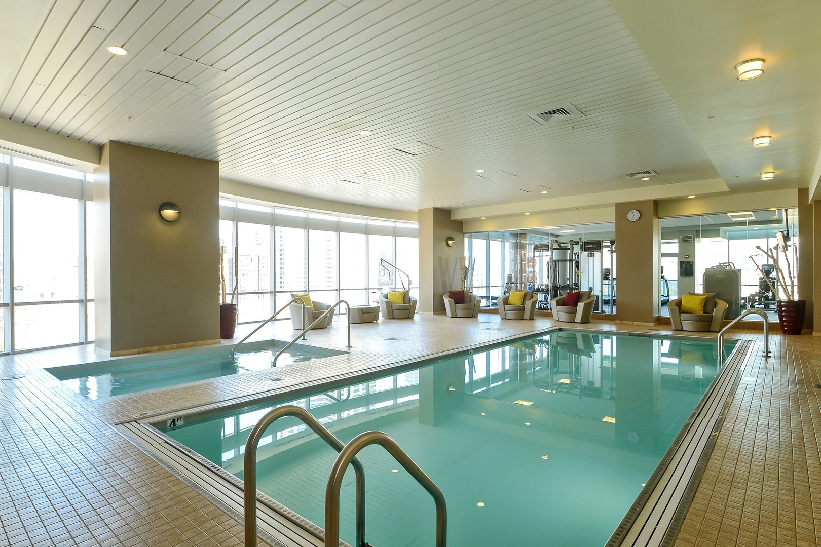 1201 South Prairie Avenue, Unit 805 Chicago, IL 60605 - Photo 22 of 23 a large swimming pool with chairs