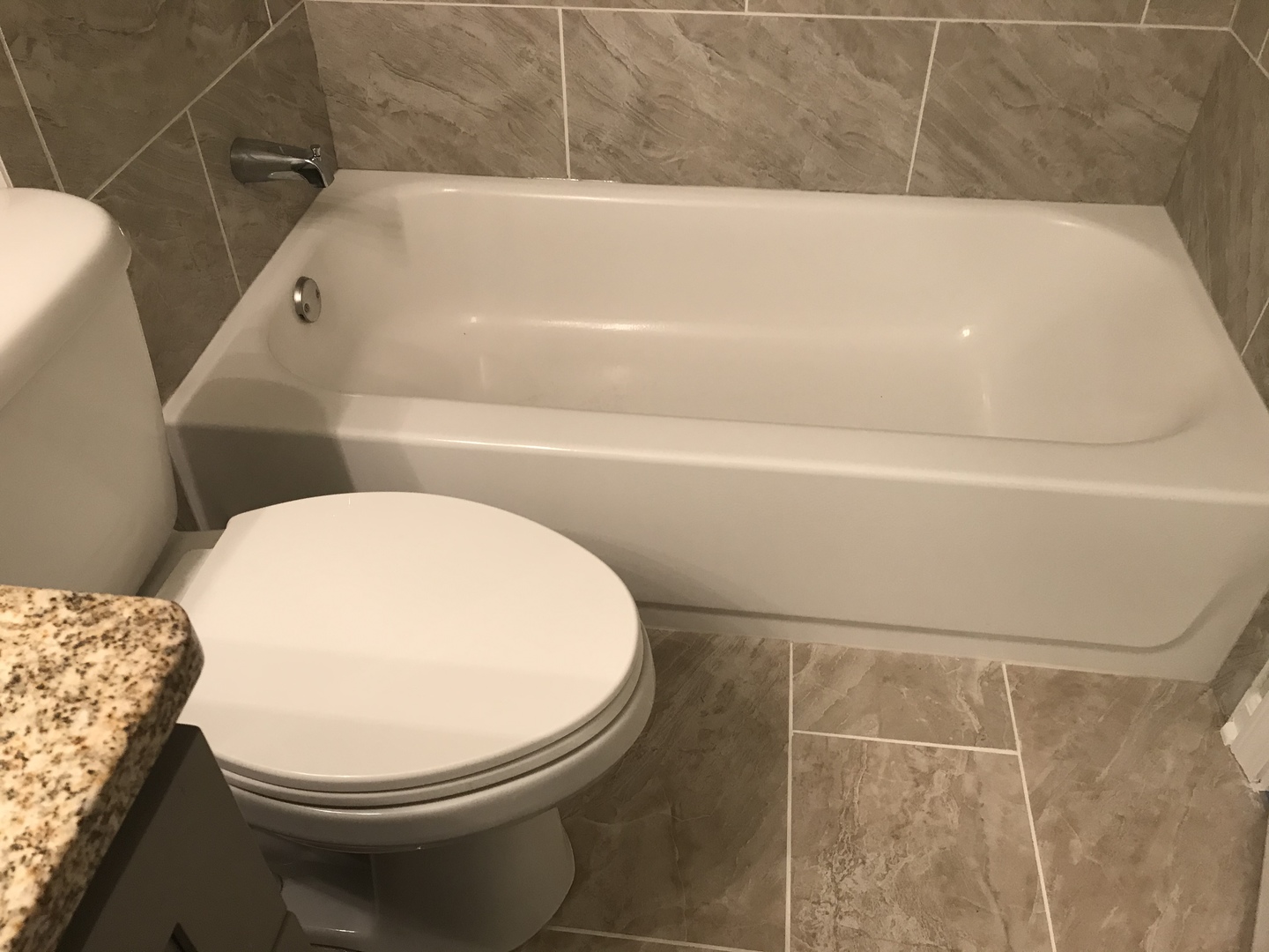 75 Saugatuck Road Montgomery, IL 60538 - Photo 12 of 22 a bathroom with a toilet and bathtub