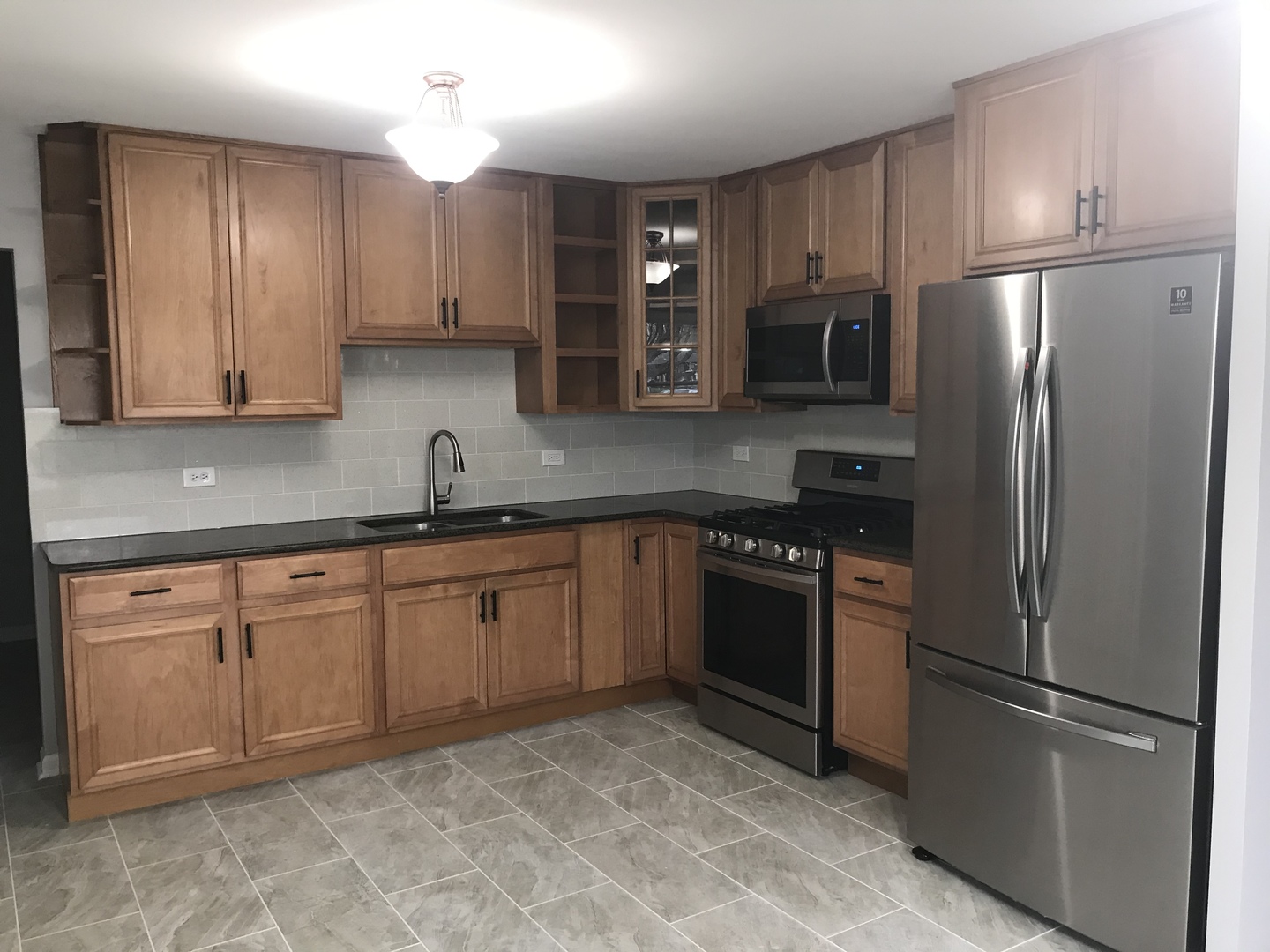 75 Saugatuck Road Montgomery, IL 60538 - Photo 5 of 22 a kitchen with stainless steel appliances granite countertop a refrigerator stove a sink and dishwasher