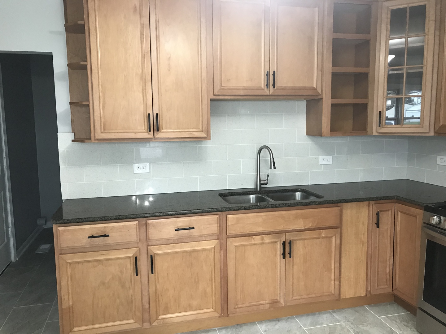 75 Saugatuck Road Montgomery, IL 60538 - Photo 6 of 22 a kitchen with white cabinets and a sink