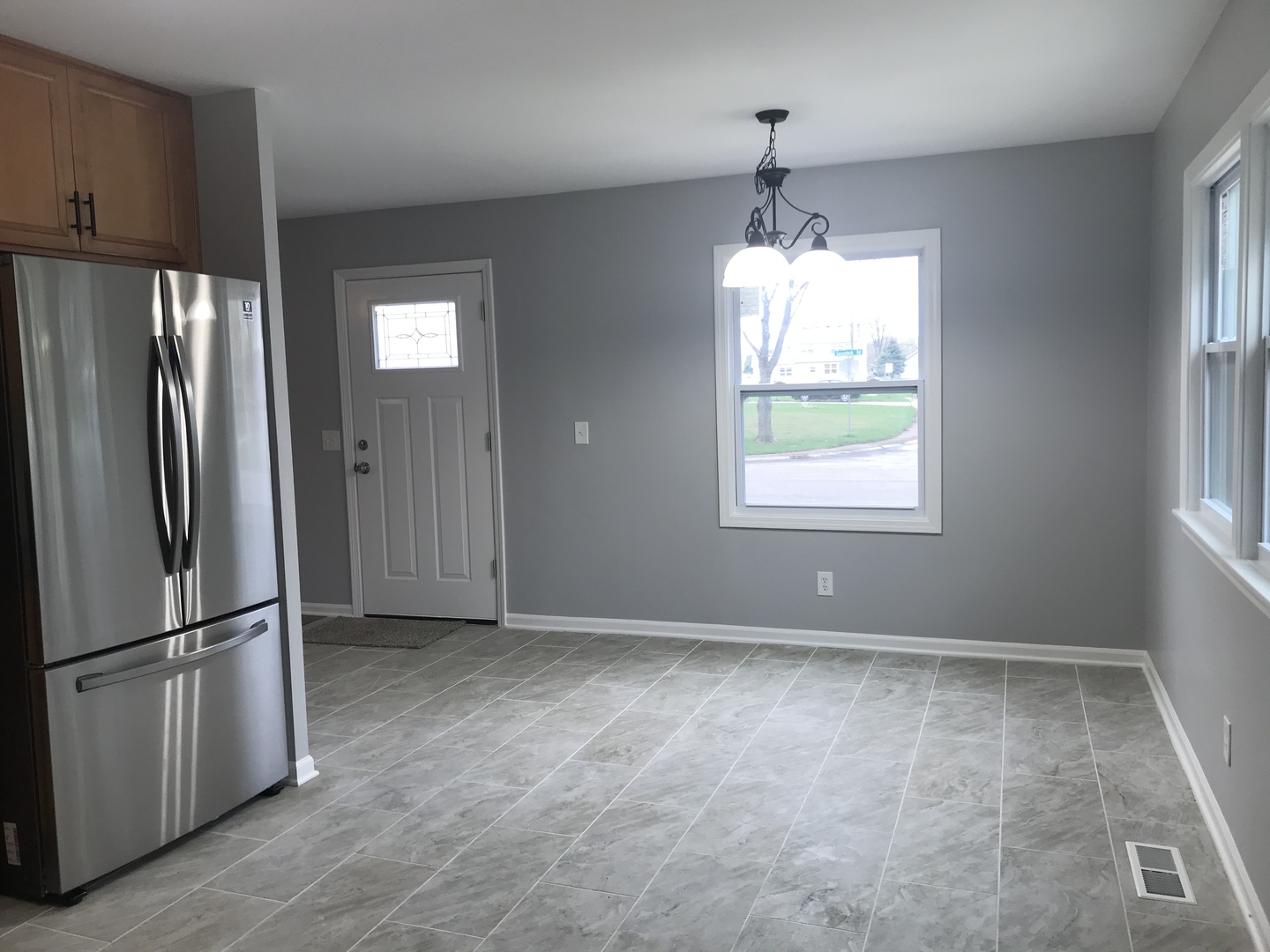 75 Saugatuck Road Montgomery, IL 60538 - Photo 7 of 22 a view of an empty room with window and refrigerator