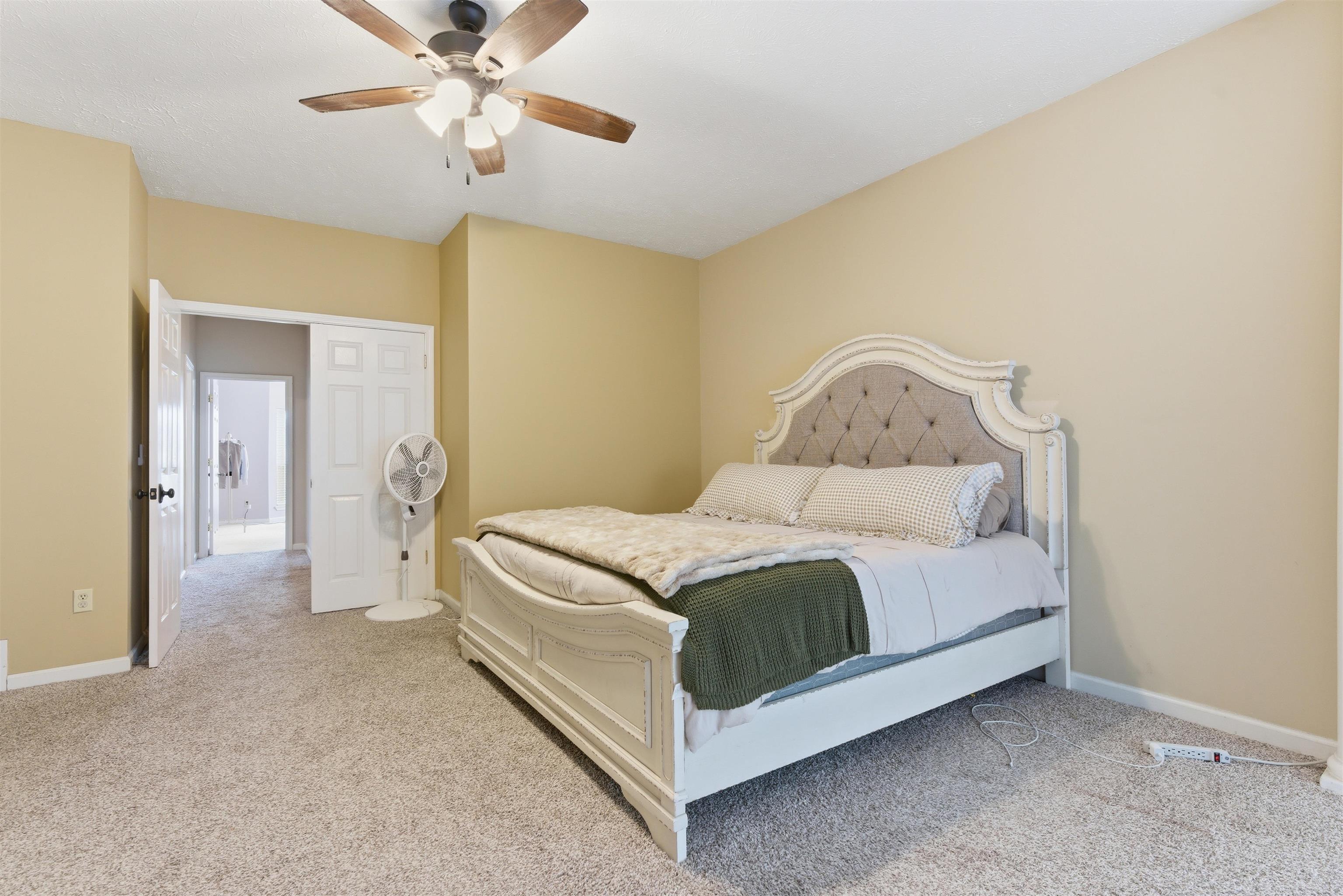 915 Cliffview Road Bolivar, TN 38008 - Photo 18 of 35 Bedroom with ceiling fan and light carpet